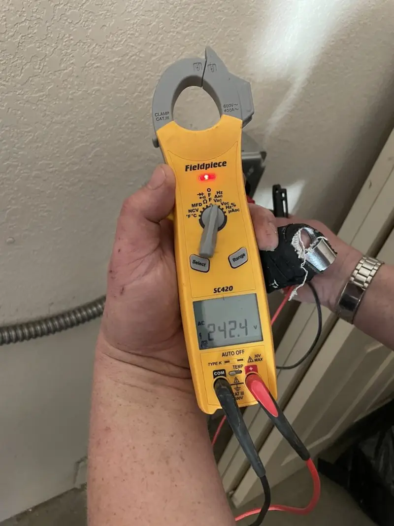 Voltage testing with clamp meter during Electrical Installation Services in Lake Zurich